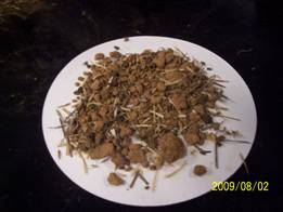 Soil with grass seeds and debris