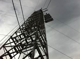 Looking up at the tower with cloudy skies