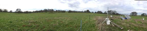 Panorama of pasture with eddy tower and solar panles