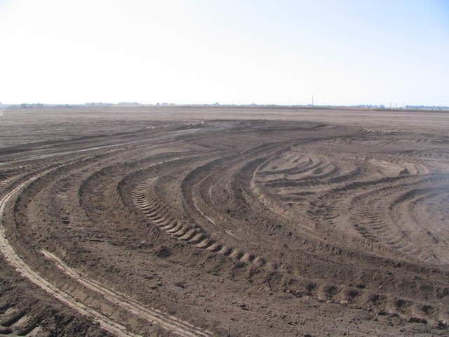 Consturction of a berm for the tower site jutting into the field from the east.