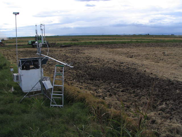 Eddy tower next to harvested, chopped and disked rice field