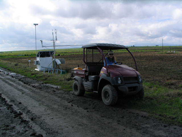 Jaclyn driving the ATV on the muddy road