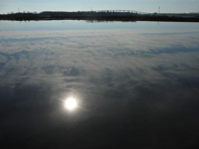 The sun reflected in the still water.