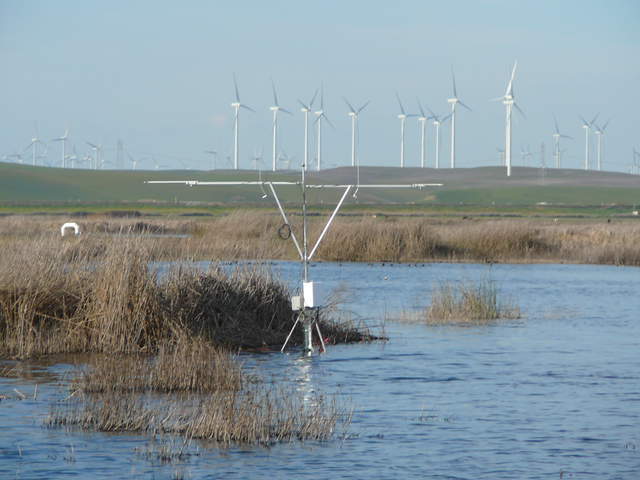 Radiometers at the new tule tower with wind turbines in the background