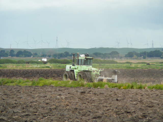 Tractor plowing the rice fields