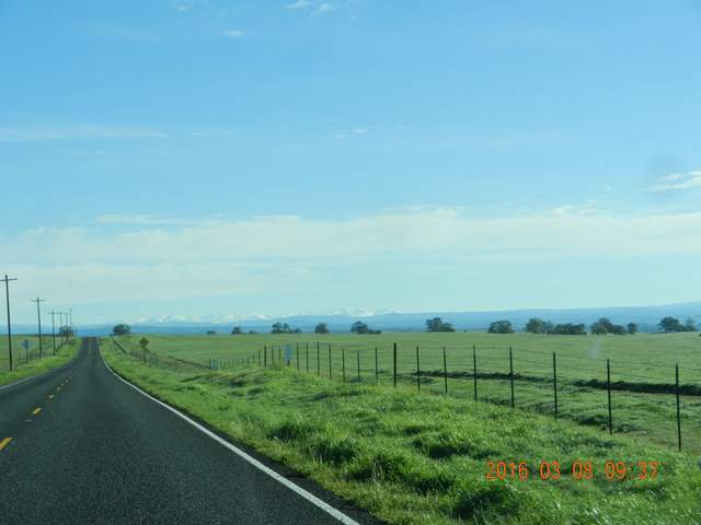 Snow in the Sierras visible from the road