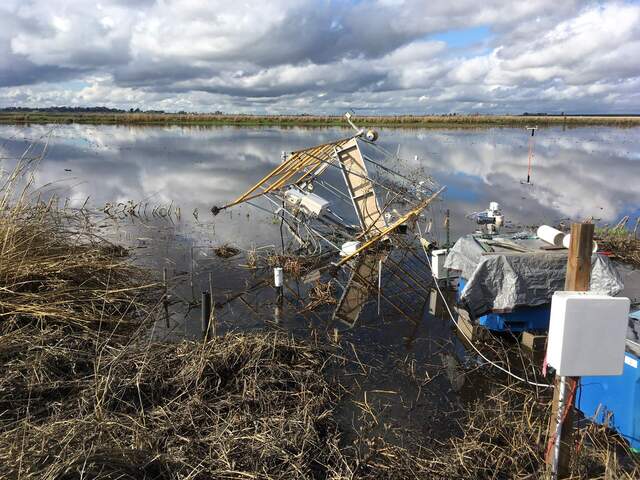 The tower fell into the flooded field probably some time on the 27th - the power was out so the exact time is still uncertain.