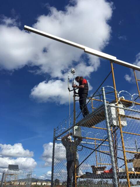 Camilo and Robert installing flux sensors. The rad boom will be installed in a different position later in the day.