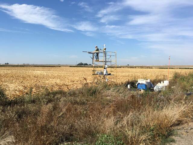 Dennis and Carlos on site. Corn has been harvested right up to the tower.