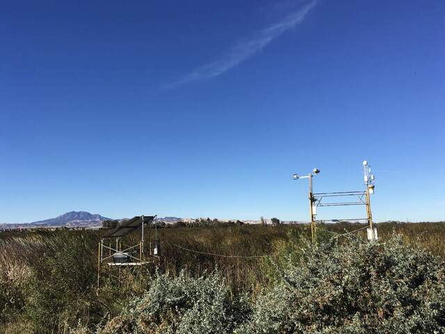 Tower and solar panels on a clear fall morning