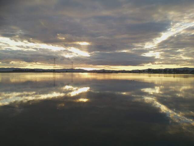 Reflected clouds at sunset