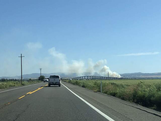 Brush smoke from a fire near the Antioch BART station