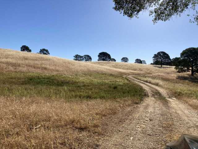 Dirt road and brown hills at Vaira