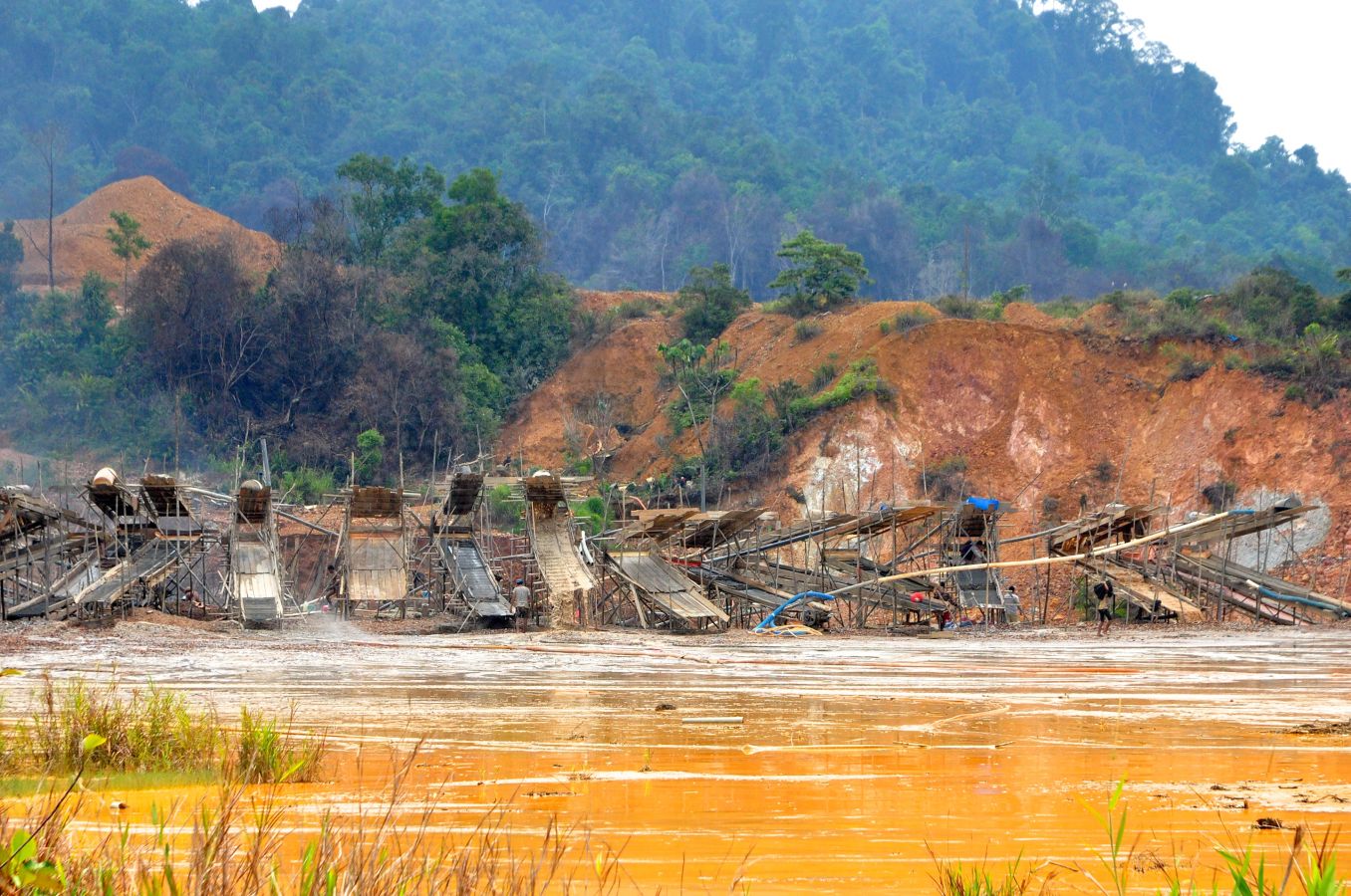 A row of sluice structures at a gold mine